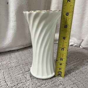 Ivory colored vase w-gold edge. 6”H X 3”WT, swirl pattern. Perfect condition!